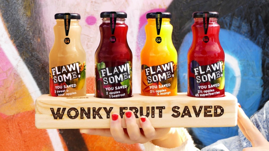 4 different flavours of Flawsome juice served in a drink board which has 'Wonky fruit saved' printed on it.