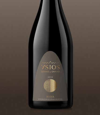 ysios - bottle of 2015 Rioja on a brown gradient background