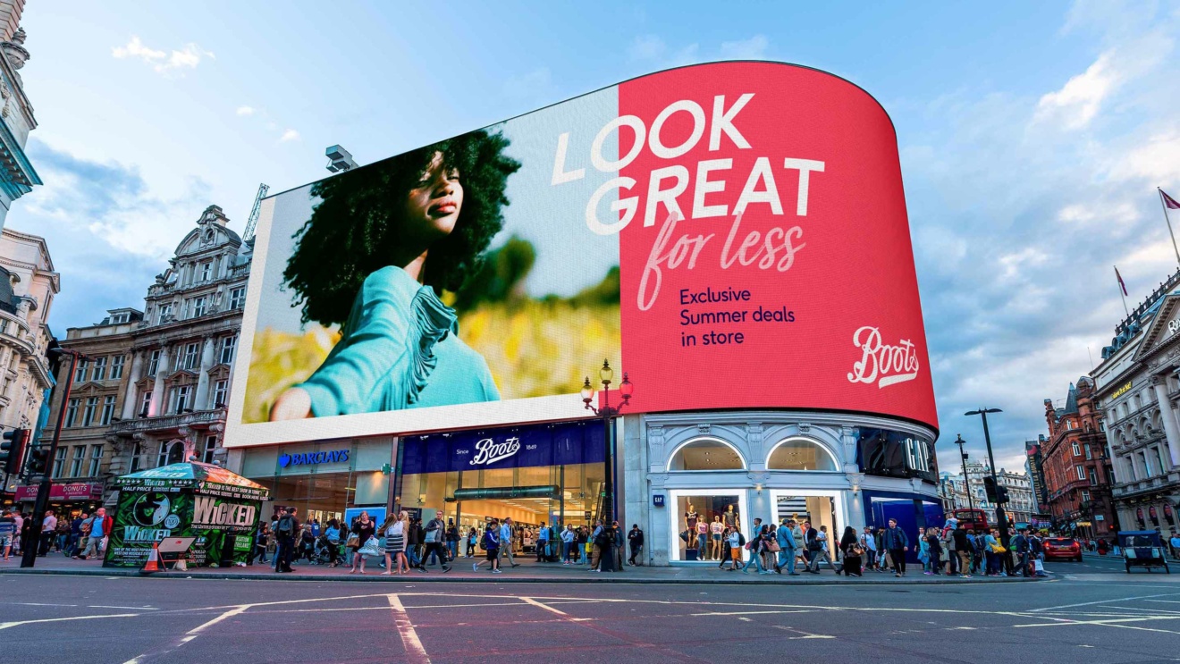 Boots - Advert displayed in Piccadilly Circus - London, the advert says 'Look great for less, exclusive summer deals in store'
