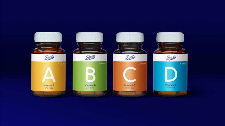 Boots - 4 Pill containers containing vitamins, vitamin A, vitamin B, vitamin C and Vitamin D