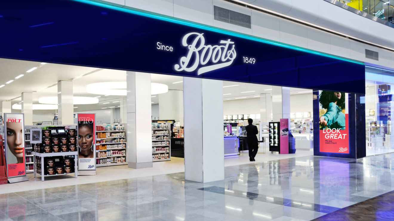 Boots - photo of outside a Boots store, with the sign clearly visible. with the insides clearly visible. The insides of the store are clearly visible and the store is inside a shopping centre.