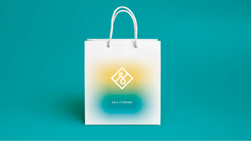Call it spring - a spray paint effect paper bag with the call it spring logo in the centre.