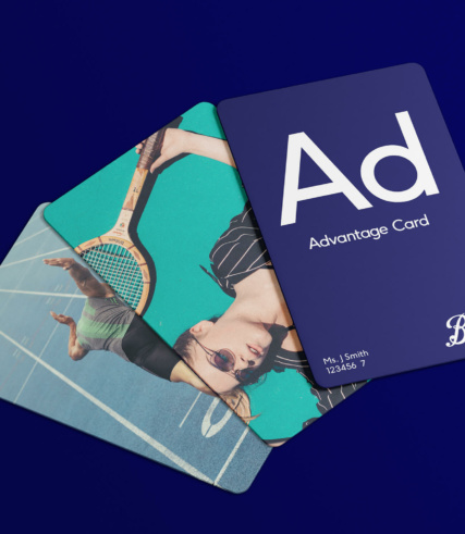 3 Boots advantage cards (loyalty cards) showed on a royal blue background. There are 3 unique designs, one has a sprinter, one has someone wielding a tennis racquet and the other just says 'Ad (like an element in the periodic table) Advantage card'