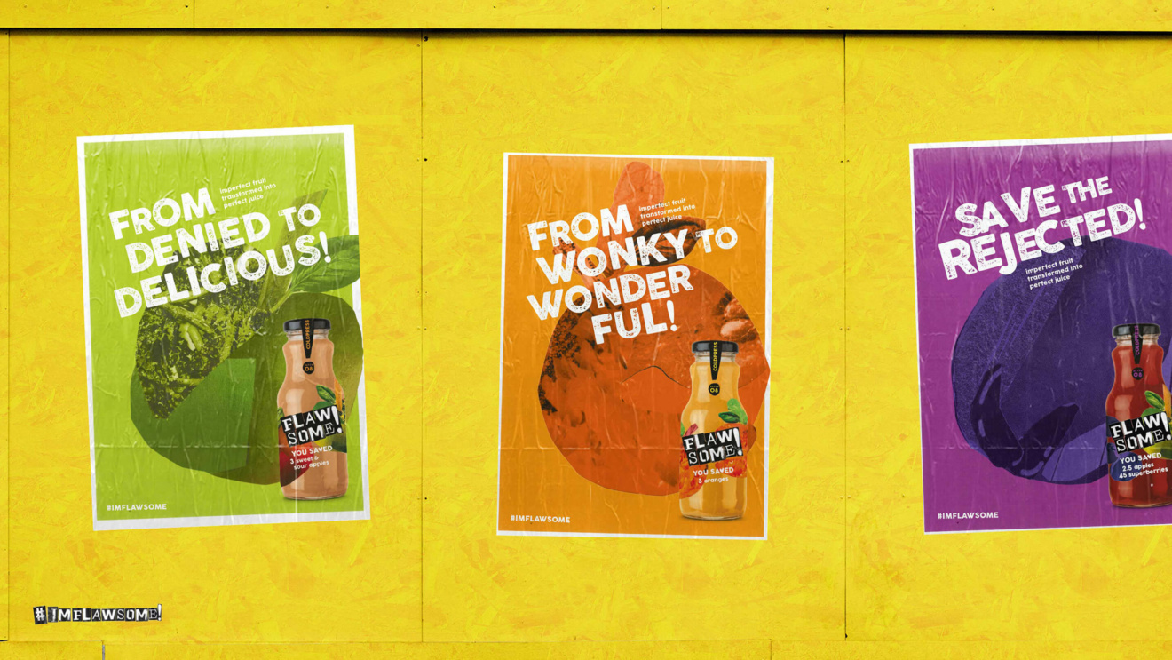 3 Flawsome posters pasted on a yellow chipboard wall. The first poster shows sweet & sour apple juice with the caption 'From denied to delicious'. The second shows orange juice with the caption 'From wonky to wonderful'. The third poster shows apple and strawberry juice with the caption 'Save the rejected'