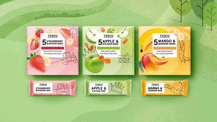 "Tesco fruit bars in flavors like Strawberry & Banana, Apple & Sultana, and Mango & Banana, with colorful packaging on a green background."