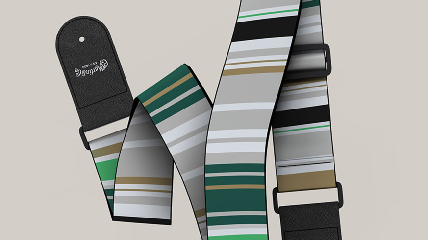 "Close-up of a Martin Guitar strap with green, gray, beige, and black stripes."